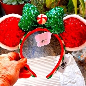 Mickey's Christmas Ears brand new with tags. Green and white stripes on the head